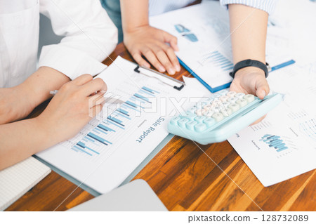 Teamwork with business people analysis cost graph on desk at meeting room. partnership analysis graph company financial budget report, cost work progress planning, business team analysis graph data 128732089