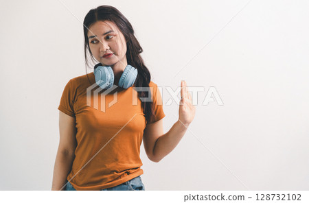 Asian girl expresses dislike, person express negative feeling, concept business complaint from customer ensuring employee satisfaction negative feedback to prevent mental strain customer dislike Asian girl expresses dislike, person express negative feeling, concept business complaint from customer ensuring employee satisfaction negative feedback to prevent mental strain customer dislike 128732102