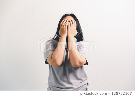 Asian girl expresses dislike, person express negative feeling, concept business complaint from customer ensuring employee satisfaction negative feedback to prevent mental strain customer dislike Asian girl expresses dislike, person express negative feeling, concept business complaint from customer ensuring employee satisfaction negative feedback to prevent mental strain customer dislike 128732107