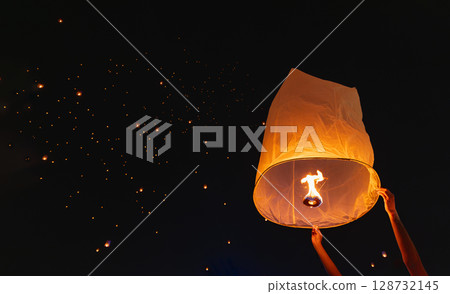 Tourist floating sky lanterns in Loy Krathong festival , Chiang Mai ,Thailand. Tourist floating sky lanterns in Loy Krathong festival , Chiang Mai ,Thailand. 128732145