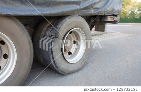 Cargo truck tire blowout on the road. 128732153