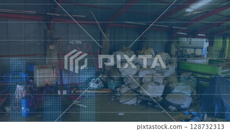 Featuring pile of white bulk bags sitting on pallets in warehouse, with green machinery, blue bins 128732313