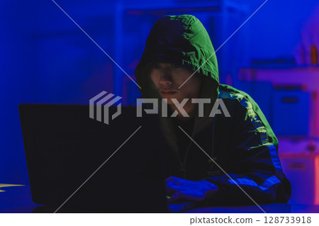 Hacker cyberattack representing data breach and cybersecurity threat in digital system 128733918