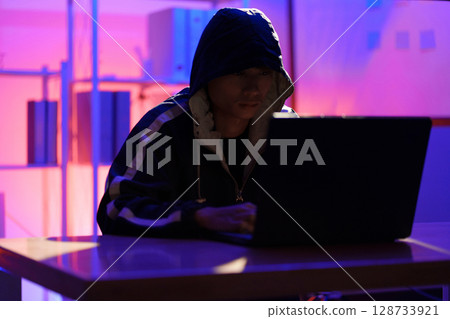 Hacker launching cyberattack targeting data systems and exposing cybersecurity vulnerabilities Hacker launching cyberattack targeting data systems and exposing cybersecurity vulnerabilities 128733921