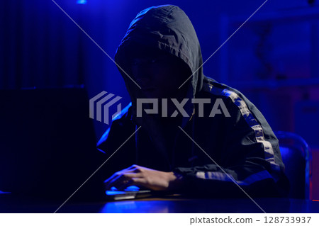 Hacker launching cyberattack targeting data systems and exposing cybersecurity vulnerabilities Hacker launching cyberattack targeting data systems and exposing cybersecurity vulnerabilities 128733937