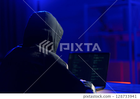Hacker launching cyberattack targeting data systems and exposing cybersecurity vulnerabilities Hacker launching cyberattack targeting data systems and exposing cybersecurity vulnerabilities 128733941