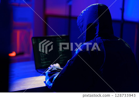 Hacker launching cyberattack targeting data systems and exposing cybersecurity vulnerabilities Hacker launching cyberattack targeting data systems and exposing cybersecurity vulnerabilities 128733943