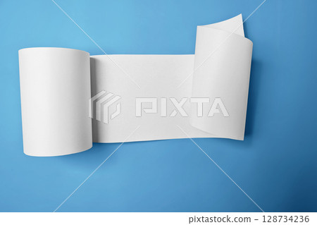 Roll of thermal paper for a receipt on a blue background. Copy space Roll of thermal paper for a receipt on a blue background. Copy space 128734236