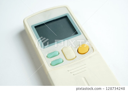 Modern remote control air conditioner on a white background Modern remote control air conditioner on a white background 128734248