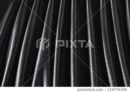 Black satin silk with crumpled abstract texture background. Material textile surface. Copy space Black satin silk with crumpled abstract texture background. Material textile surface. Copy space 128734266