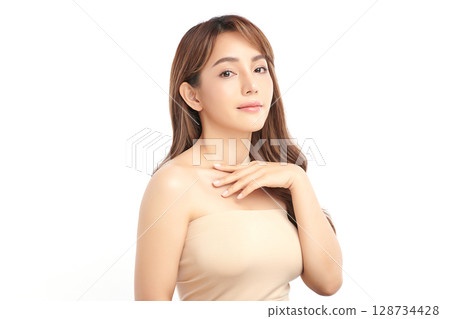 A beautiful young Asian woman with clean, fresh skin against a white background. Skincare, facial treatment, cosmetology, beauty, and spa. An elegant portrait of an Asian woman. 128734428