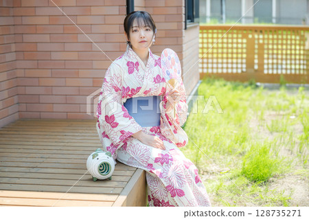 Cool woman on the veranda Cool woman on the veranda 128735271