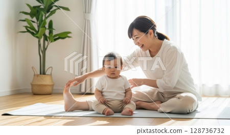 A heartwarming daily life of parents and children enjoying baby yoga A heartwarming daily life of parents and children enjoying baby yoga 128736732