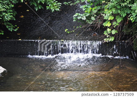 Quiet man-made river 128737509