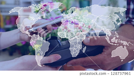 Image of world map over mid section of woman making a payment through his smartphone Image of world map over mid section of woman making a payment through his smartphone 128737961