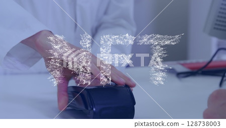 Image of nft text banner over mid section of man making a payment by his credit card 128738003