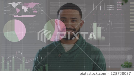 Statistical data processing against portrait of african american man smiling at office 128738087