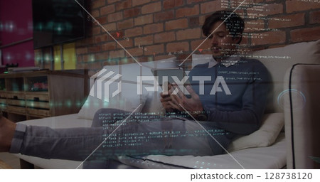Image of data processing over businessman using tablet 128738120