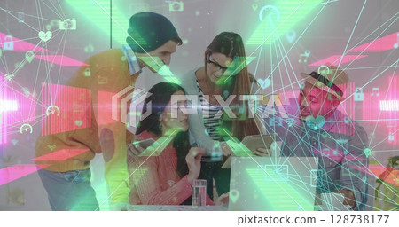 Two globes of digital icons against group of diverse office colleagues discussing together at office Two globes of digital icons against group of diverse office colleagues discussing together at office 128738177