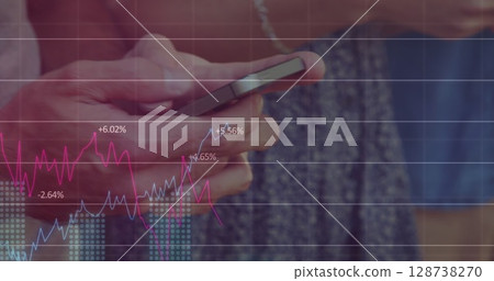 Image of graphs over hands of caucasian people using smartphones 128738270