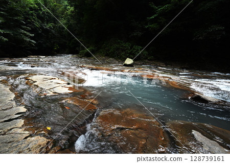 The Senjojiki River flows through the forests of Kirishima 128739161