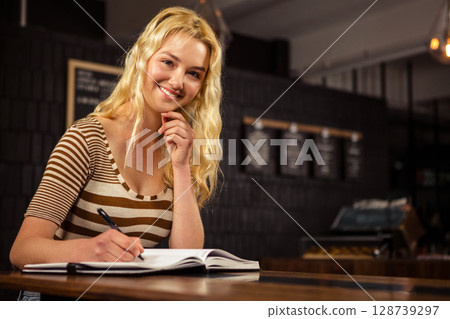 woman, writing, baked goods 128739297