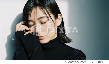 Portrait of a sophisticated woman in a black turtleneck 128740853