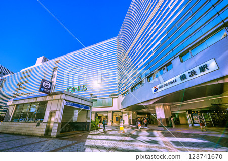 Yokohama cityscape, Japan, July 21st. In the intense heat...SOTETSU Yokohama Station and sunlight. Yokohama cityscape, Japan, July 21st. In the intense heat...SOTETSU Yokohama Station and sunlight. 128741670