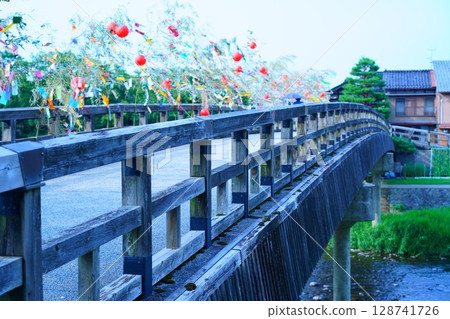 Colorful Tanabata decorations on a wooden bridge 128741726