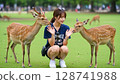 Female tourist and deer 128741988