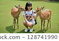 Female tourist and deer 128741990