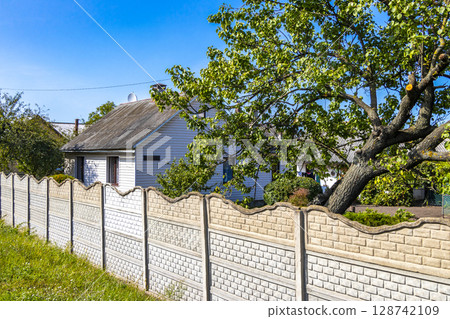 Brest Belarus colorful village streets with wooden huts brick houses . 128742109
