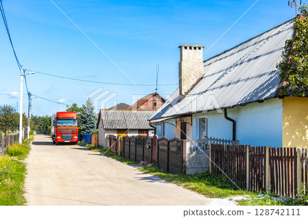 Brest Belarus colorful village streets with wooden huts brick houses . Brest Belarus colorful village streets with wooden huts brick houses . 128742111