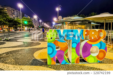 Copacabana beach promenade at night in Rio de Janeiro Brazil. Copacabana beach promenade at night in Rio de Janeiro Brazil. 128742199