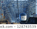 Silver Wings E3 Yamagata Shinkansen train racing up the hill from Ueno Station 128743539