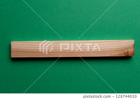 Simple background of wooden boards on a green background 128744010