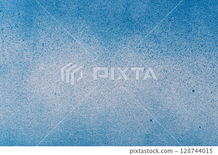 Blue spray paint background Blue spray paint background 128744015