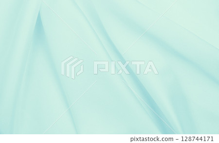 Smooth elegant blue silk or satin luxury cloth texture as abstract background. Luxurious background design 128744171