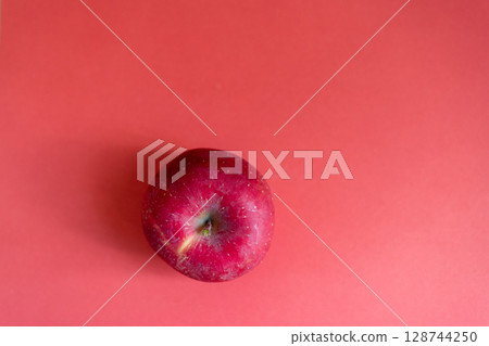 Delicious apples on a red background 128744250