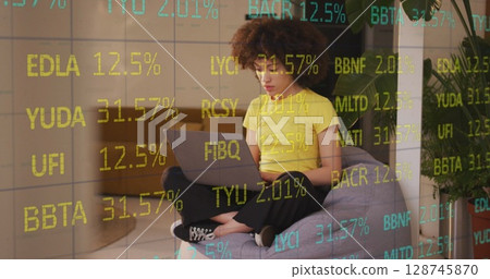 Image of data processing over businesswoman using laptop in office 128745870