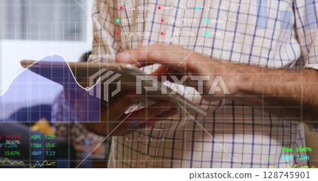 Image of data processing over caucasian businessman using tablet 128745901
