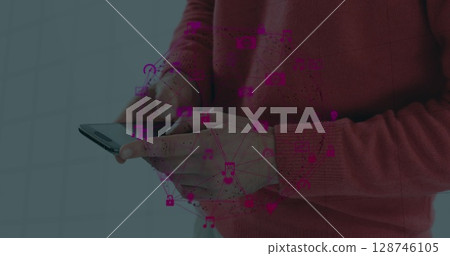 Globe of digital icons spinning against mid section of a person using smartphone Globe of digital icons spinning against mid section of a person using smartphone 128746105