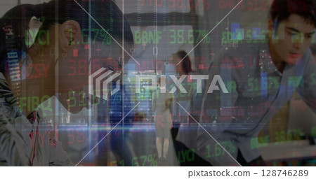 Stock market data processing over diverse male and female engineers working at office 128746289