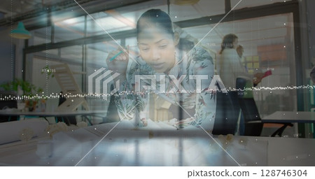 Image ofdata processing against african american female engineer working on her model at office 128746304