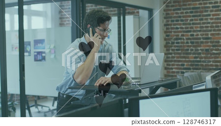 Image of hearts floating over caucasian businessman having call in office Image of hearts floating over caucasian businessman having call in office 128746317