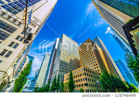 Tokyo cityscape, Japan, July 20th. View of the intersection in front of Otemachi Station and express trains. In the background is Nihonbashi... 128746499