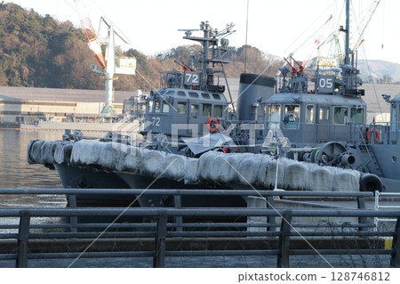 Maritime Self-Defense Force ships anchored at the port 128746812