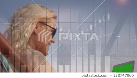 Image of statistical data processing over caucasian woman using laptop with copy space 128747060