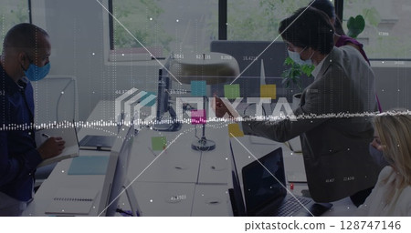 Data processing against diverse office colleagues wearing face masks discussing over memo notes 128747146