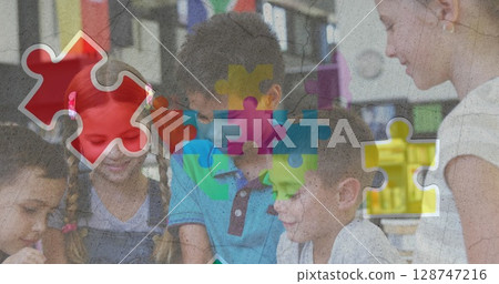 Image of colorful puzzle and heart over diverse children with tablets Image of colorful puzzle and heart over diverse children with tablets 128747216